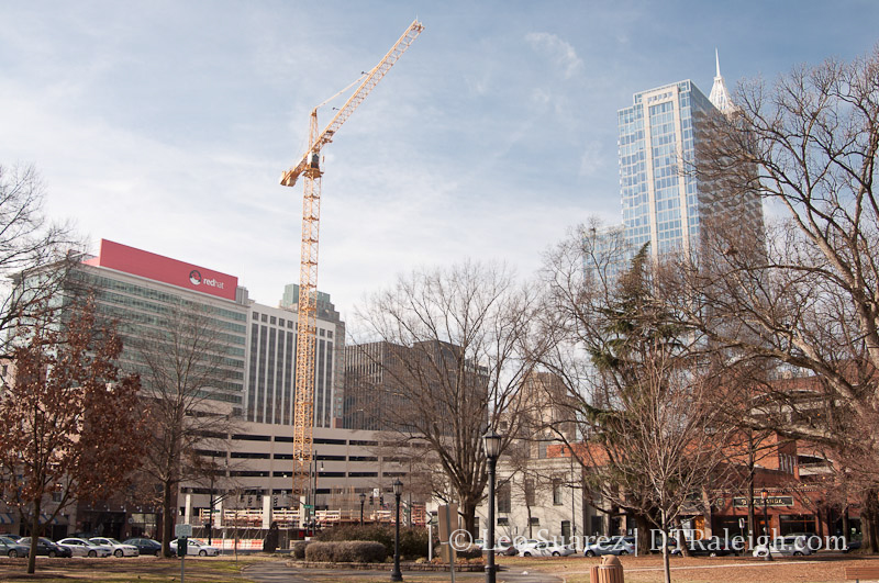 Moore Square with Skyhouse Raleigh under construction in view.