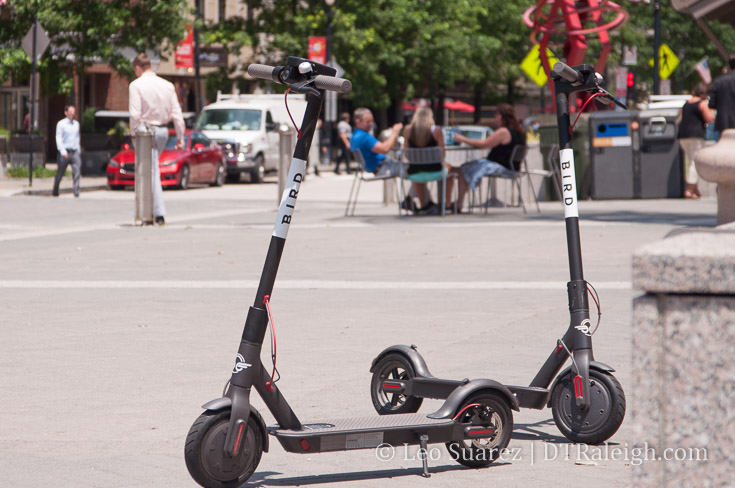 Two electric scooters in City Plaza